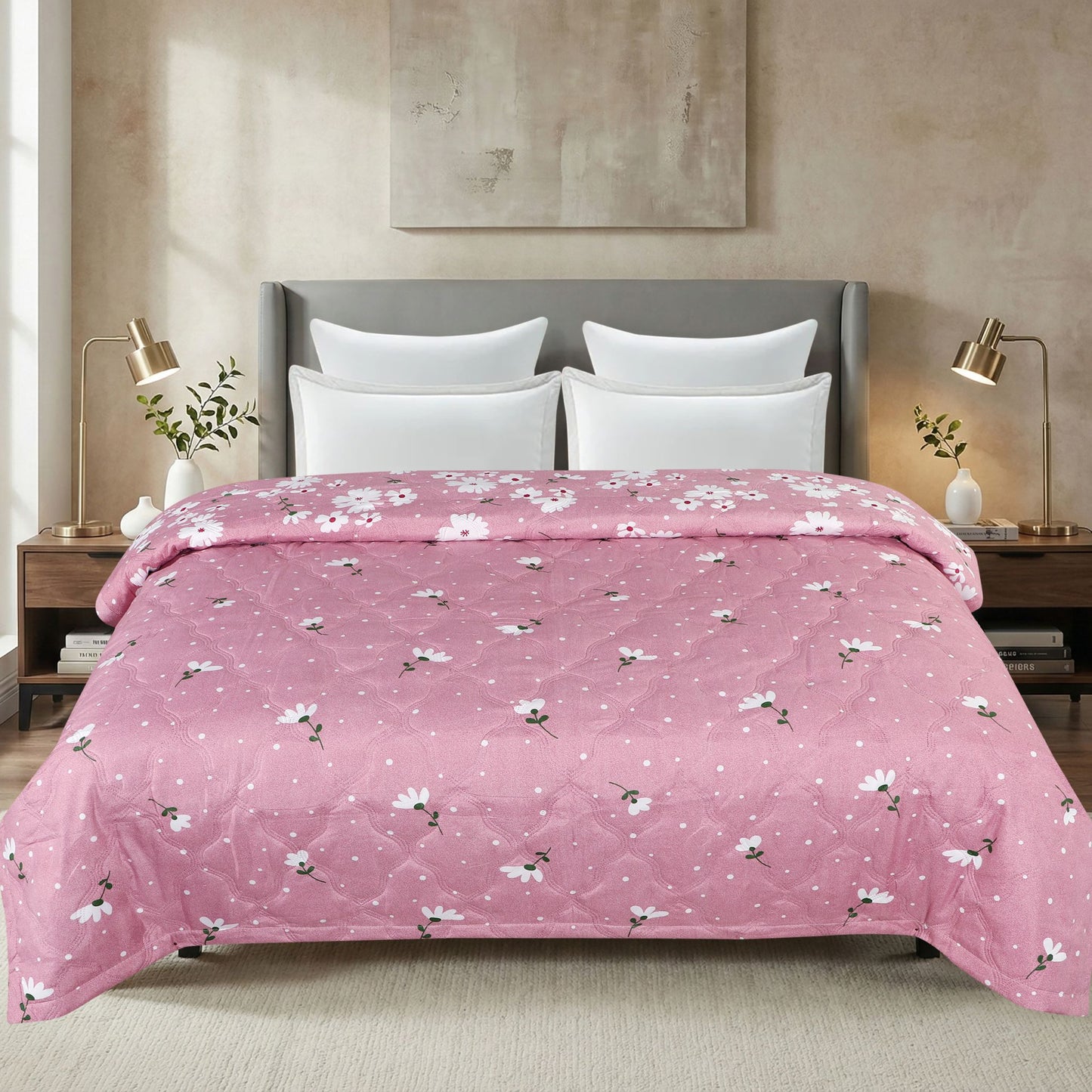 Bed with pink floral comforter in a bedroom setting