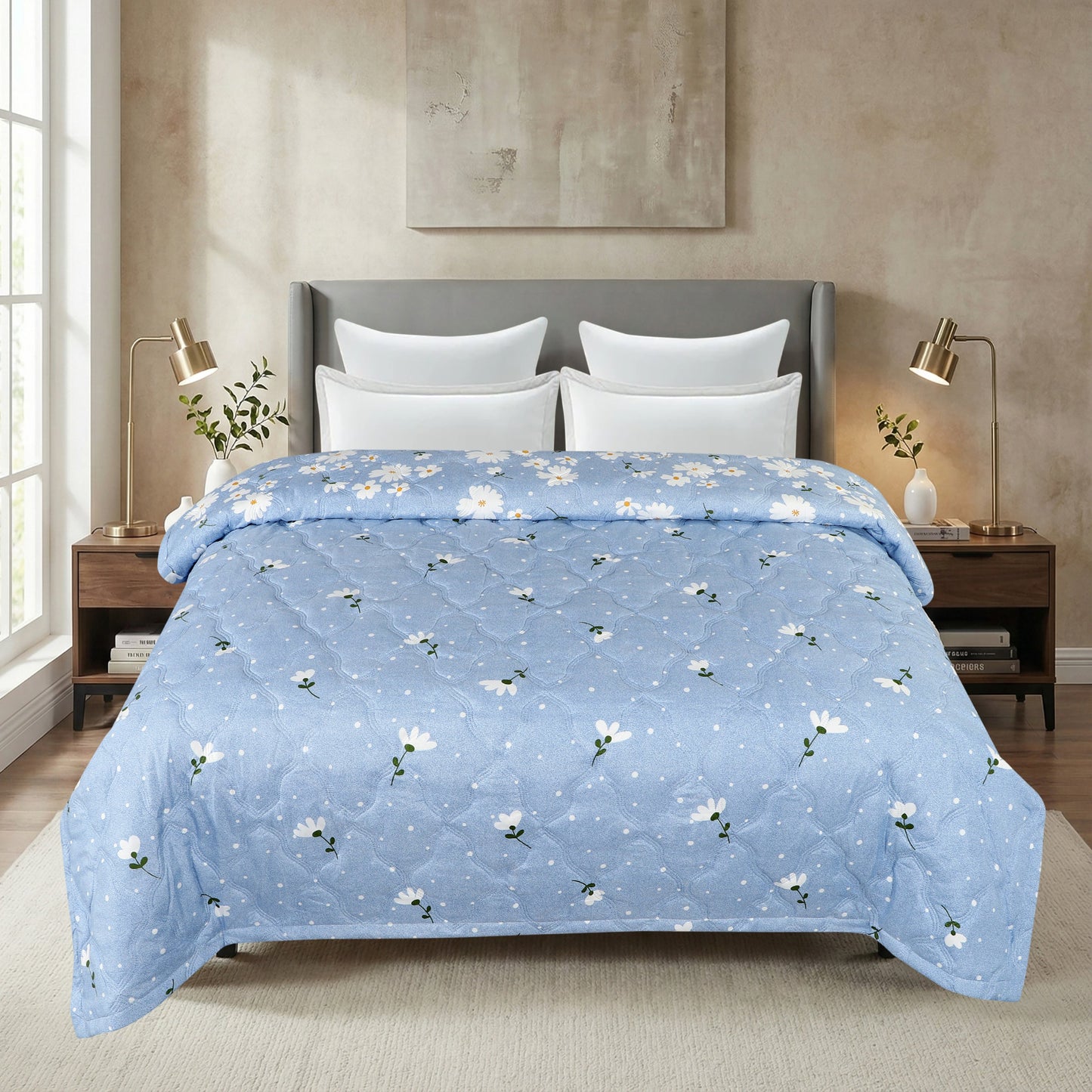 Blue floral comforter on a bed in a bedroom setting